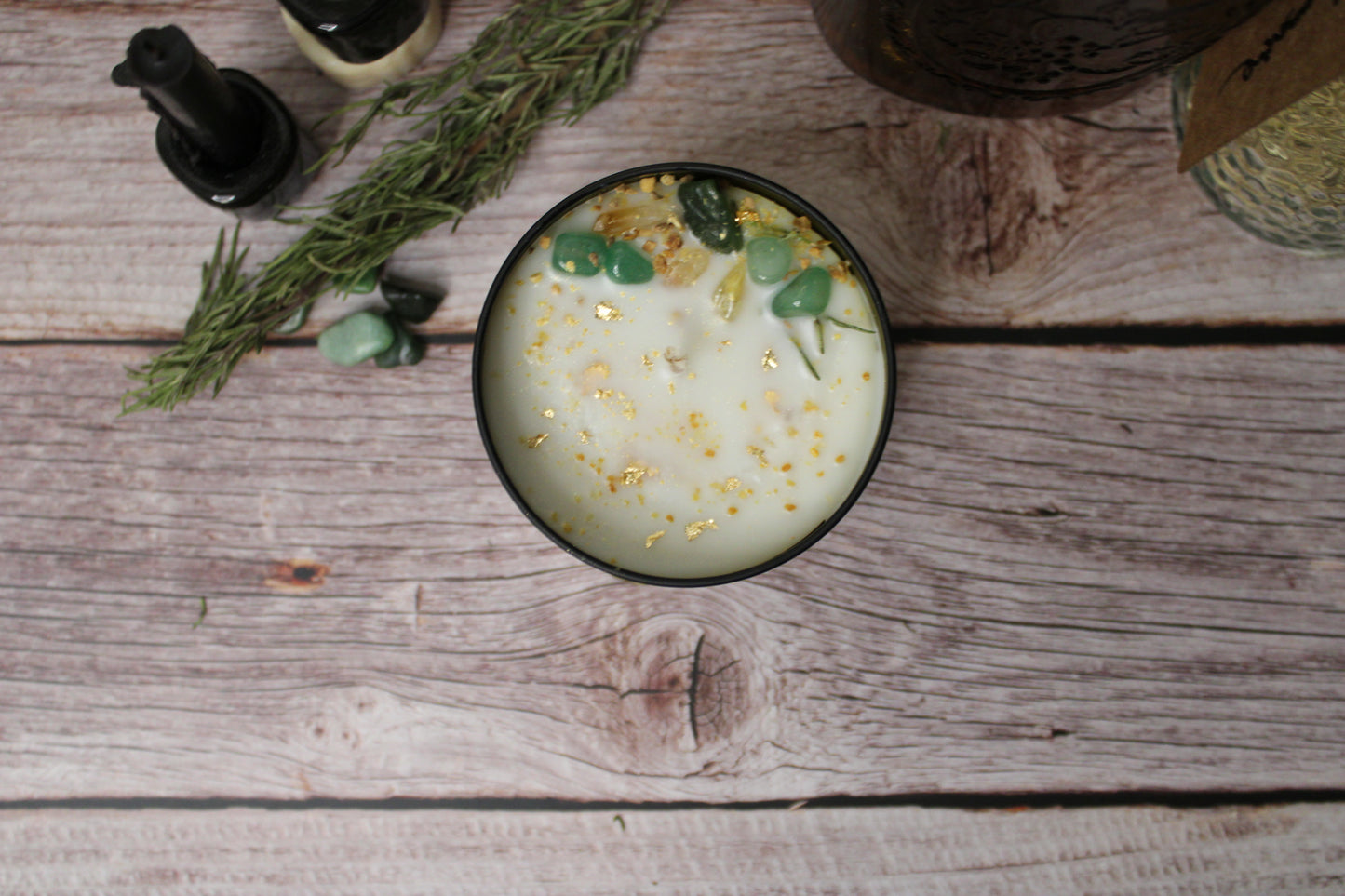 Candle with decorative elements on a wooden surface