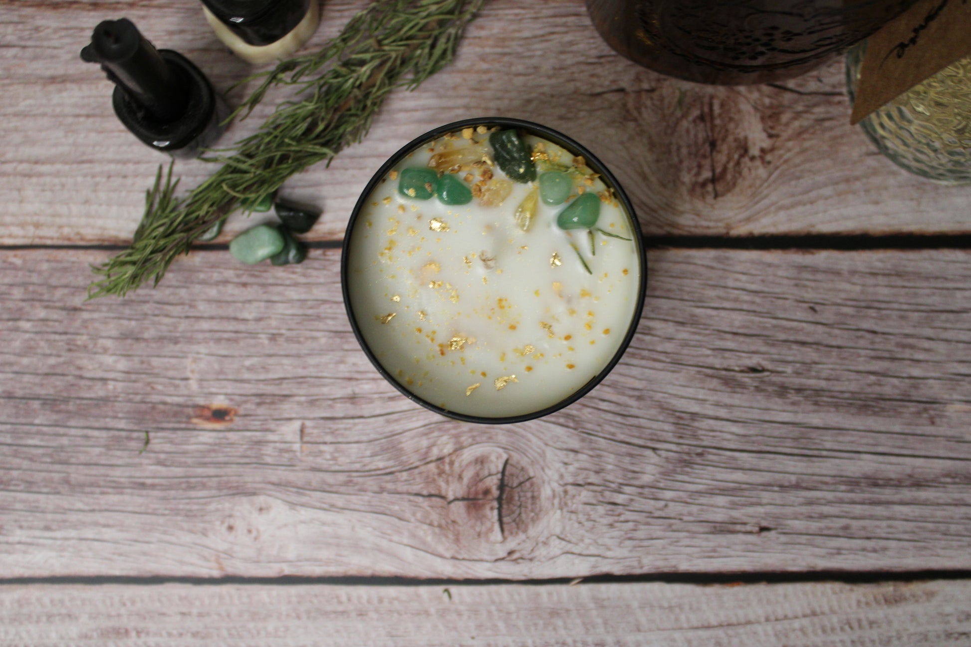 Candle with decorative elements on a wooden surface